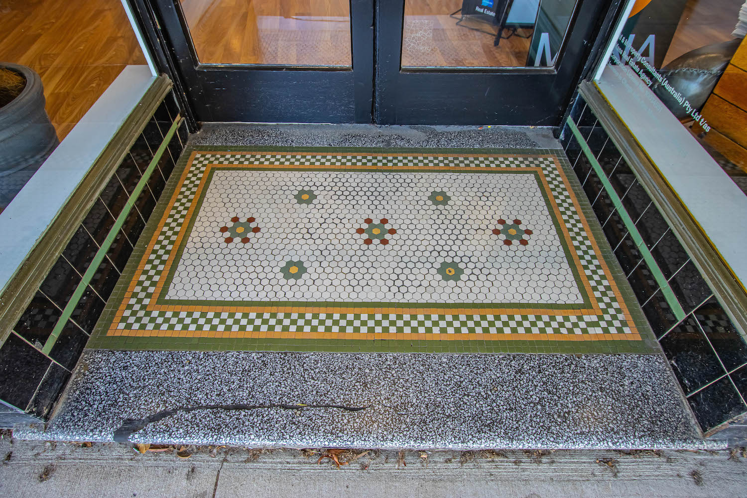 Grand historical entrance with patterened tiles, steeped in history.